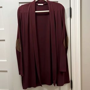 Long soft cotton cardigan with round brown suede elbow patches. Like new!